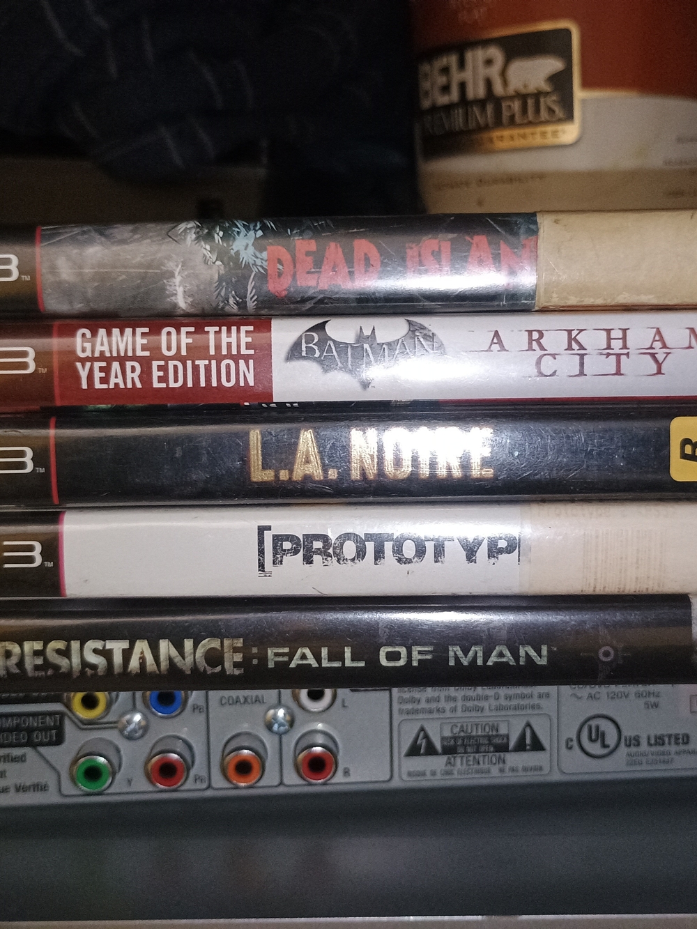 Stack of PS3 Game Cases Featuring Dead Island, Batman: Arkham City, L.A. Noire